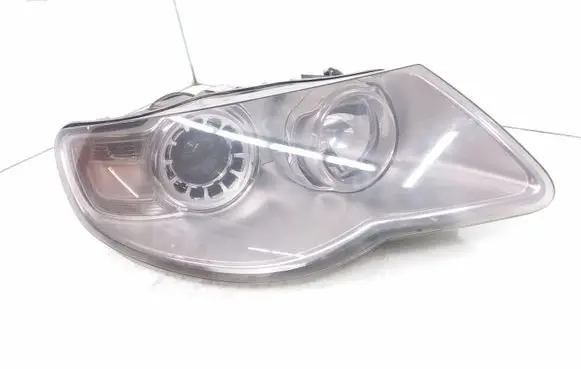 Volkswagen Touareg I Headlight/headlamp 7L6941032A 1LL24703204
