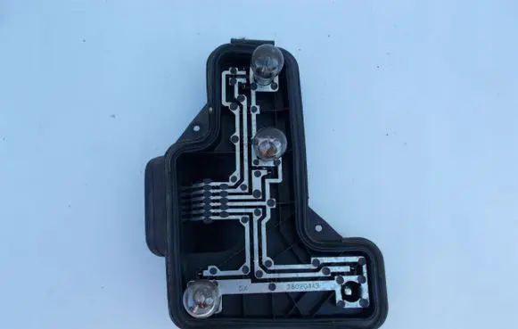 Tail light bulb cover holder