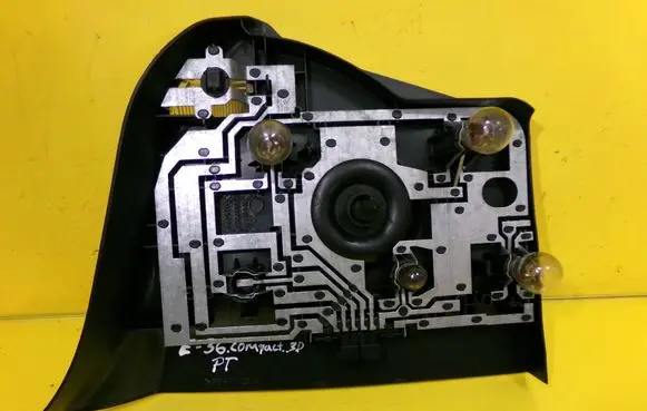 Tail light bulb cover holder