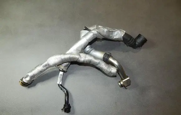 Volkswagen Golf VII Engine coolant pipe/hose 06K121065K