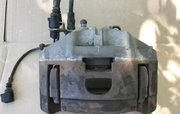 Audi A6 S6 C6 4F Front brake caliper 973