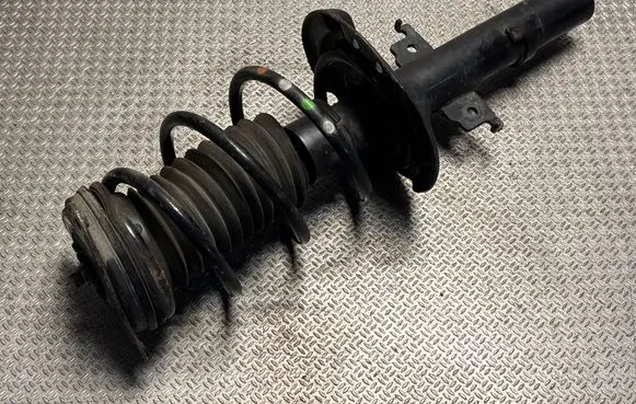 Front shock absorber with coil spring