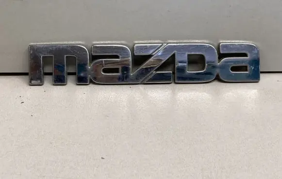 Mazda 323 F Manufacturers badge/model letters GE5A51711