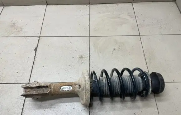 Volkswagen Caddy Front shock absorber with coil spring 6K0413031G