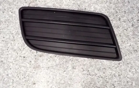 Suzuki Swift I Front fog light trim/grill