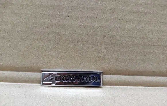 Renault Laguna III Front door emblem/model letters 990882613R