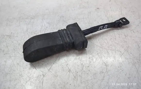 Front door check strap stopper