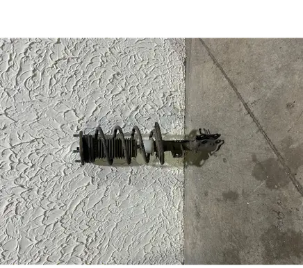 Front shock absorber with coil spring