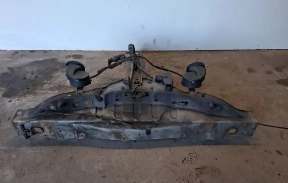 Radiator support slam panel bracket
