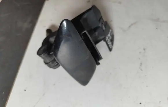 Headlight washer spray nozzle