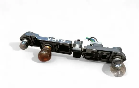 Tail light bulb cover holder