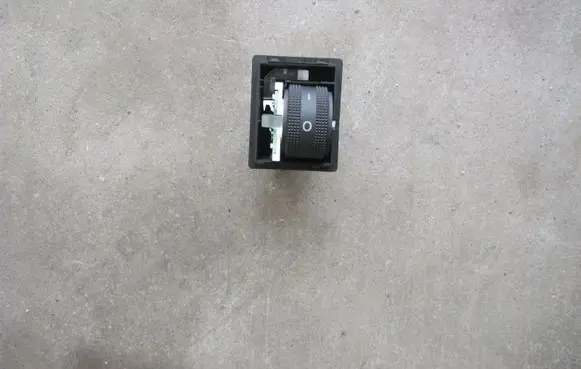 Headlight level height control switch