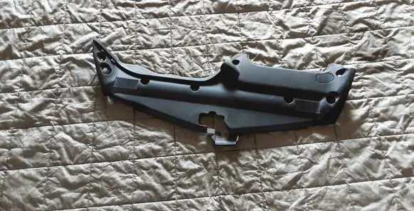 Engine bonnet/hood lock trim molding