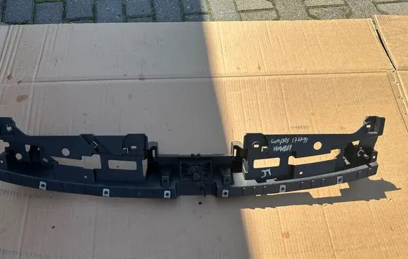 Engine bonnet/hood lock trim molding