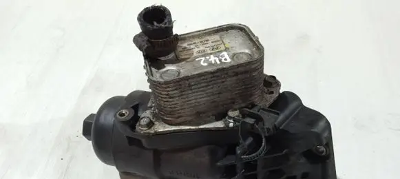 KIA Carens III Oil filter mounting bracket 264102A300 K100200