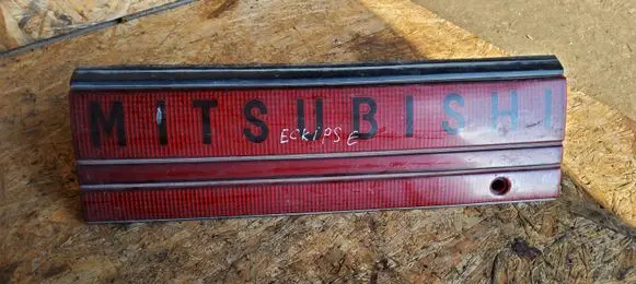 Mitsubishi Eclipse Trunk door license plate light bar 1896001