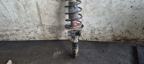 Front shock absorber with coil spring
