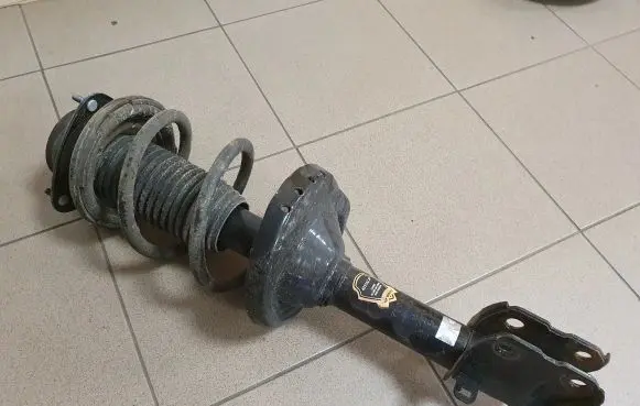 Subaru Outback Front shock absorber with coil spring