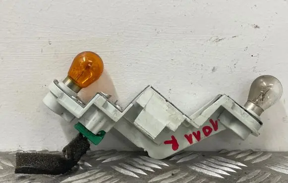 Tail light bulb cover holder