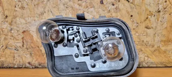 Mitsubishi Colt Tail light bulb cover holder 27852101 27859005