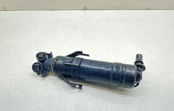 Volkswagen Touran II Headlight washer spray nozzle 1T0955103B