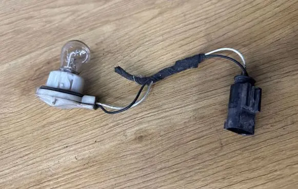 Opel Vivaro Tail light bulb cover holder