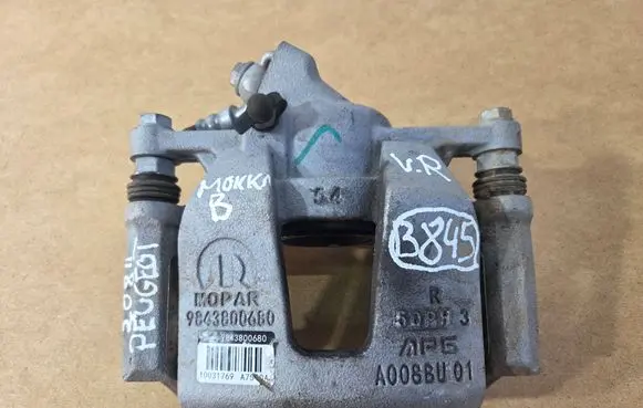 Opel Corsa F Front brake caliper 9843800680