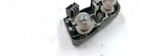 Tail light bulb cover holder