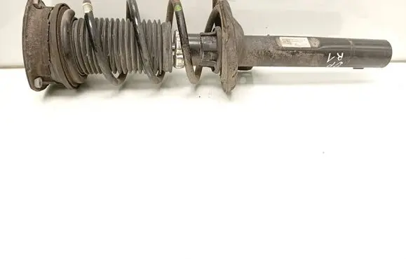 Volkswagen Golf VII Front shock absorber with coil spring 5Q0413023FK