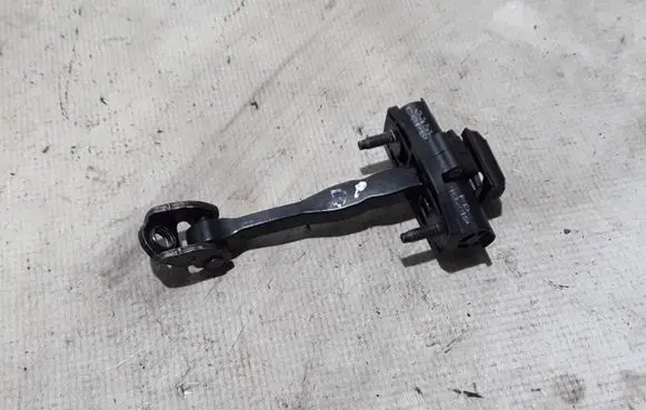Front door check strap stopper