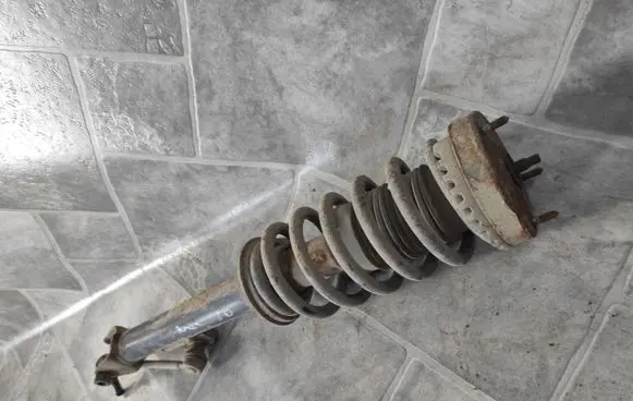 Chrysler 300 - 300C Front shock absorber with coil spring 04782734AD