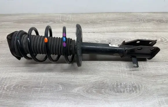 Peugeot 2008 II Front shock absorber with coil spring 9836654880 ST32000774