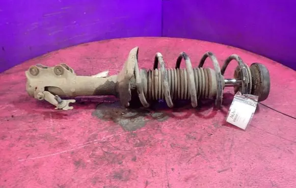 Volkswagen Golf III Front shock absorber with coil spring 1H0413031N