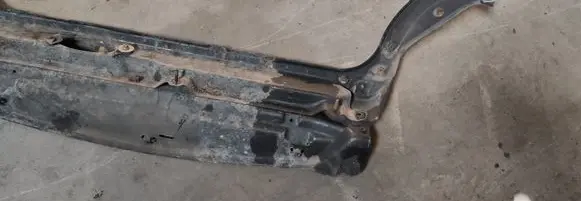 Radiator support slam panel bracket