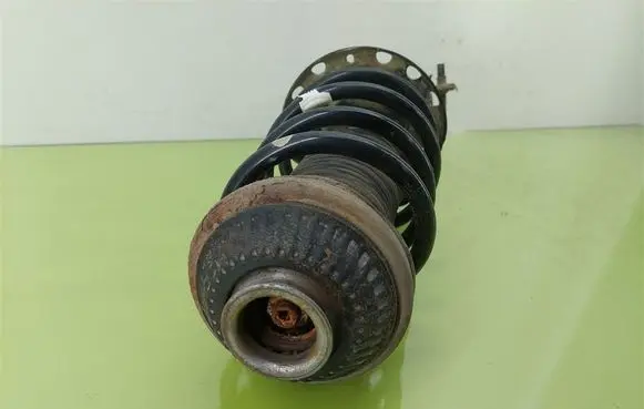 Opel Astra H Front shock absorber with coil spring 22214603