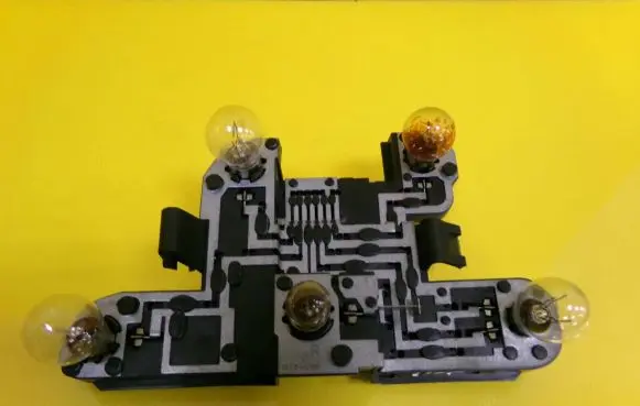 Tail light bulb cover holder