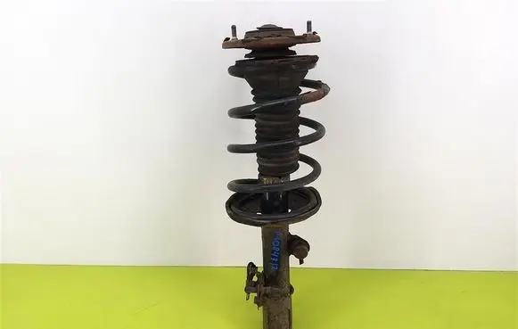 Toyota Corolla E120 E130 Front shock absorber with coil spring 