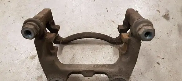 Volkswagen PASSAT B7 Brake caliper pad carrier rear 3C0615425