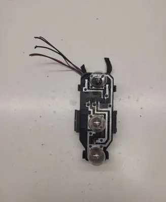 Tail light bulb cover holder