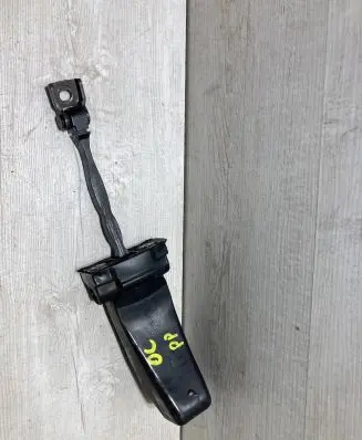 Front door check strap stopper