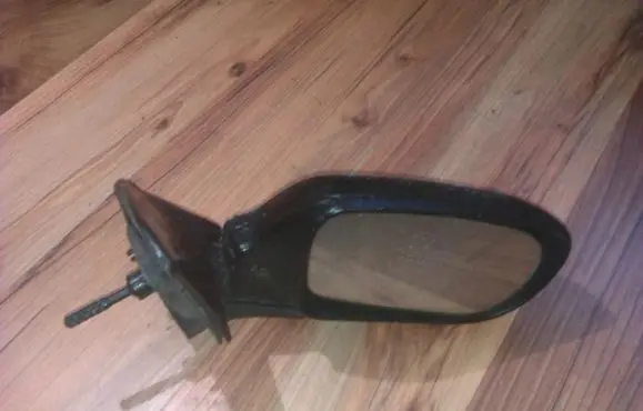 Mazda 323 Front door electric wing mirror e11011164