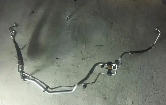 Peugeot Partner Air conditioning (A/C) pipe/hose 98317021 87291F03