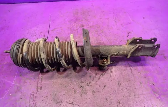 Opel Corsa D Front shock absorber with coil spring 