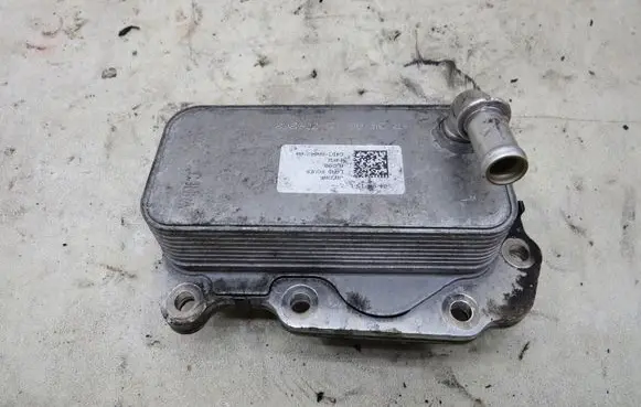 Jaguar XF X260 Engine oil radiator G4D3-6A642-AA
