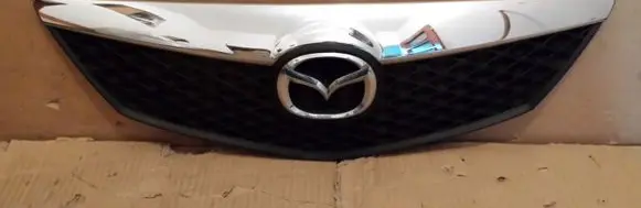 Mazda 2 Front bumper upper radiator grill