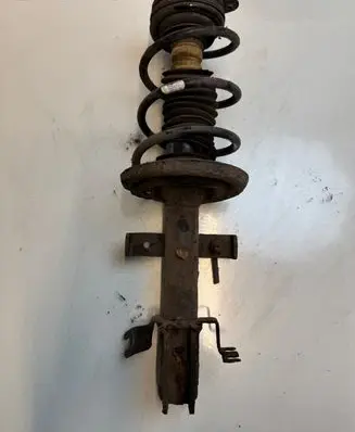 Renault Clio III Front shock absorber with coil spring 321123