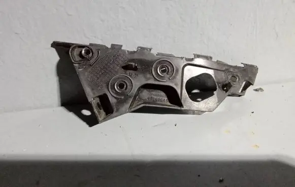 Opel Corsa D Front bumper mounting bracket 13179964