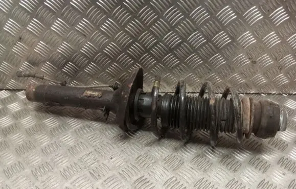 Volkswagen Golf IV Front shock absorber with coil spring 1J0413031AE