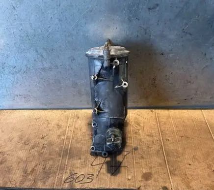 Mercedes-Benz E W124 Oil filter mounting bracket 6031840702 6011840025