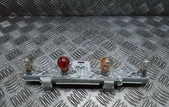 Tail light bulb cover holder